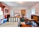 Bedroom with painted pink walls, hardwood flooring, and lots of furniture at 611 E Marion St, Shelby, NC 28150