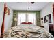 Large bed with wooden frame situated in a room with green and white walls at 611 E Marion St, Shelby, NC 28150