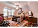 Bedroom with floral wallpaper, hardwood floors, and a ceiling fan at 611 E Marion St, Shelby, NC 28150