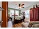 Charming bedroom featuring a four-poster bed, wood floors and a ceiling fan at 611 E Marion St, Shelby, NC 28150