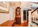 Foyer with ornate wooden furniture, wood floors and staircase at 611 E Marion St, Shelby, NC 28150