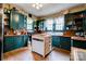 Classic kitchen featuring green cabinetry, butcher block countertops, and a center island at 611 E Marion St, Shelby, NC 28150