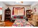 Comfortable living room featuring wood floors, neutral sofa, and built-in bookshelves at 611 E Marion St, Shelby, NC 28150