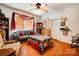 Cozy living room with hardwood floors, a ceiling fan, and comfortable seating at 611 E Marion St, Shelby, NC 28150