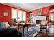 Cozy living room with a fireplace, built-in bookcase, and traditional decor at 611 E Marion St, Shelby, NC 28150