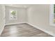 Bright bedroom with natural light, fresh paint, and durable wood-look flooring at 6328 Beecher Dr, Charlotte, NC 28215