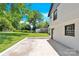 Back patio with white brick border and lush green yard at 6328 Beecher Dr, Charlotte, NC 28215