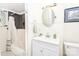Bathroom featuring bathtub with shower, vanity with mirror, and wainscotting at 636 N Center St, Statesville, NC 28677