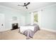Bedroom with fireplace, window, and neutral color palette at 636 N Center St, Statesville, NC 28677