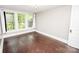 Bedroom featuring hardwood floors, and a large window at 636 N Center St, Statesville, NC 28677