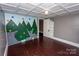 Bedroom showcasing a climbing wall, decorative ceiling, and hardwood floors at 636 N Center St, Statesville, NC 28677