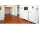 Inviting foyer with hardwood floors, paneled walls, and stylish white storage cabinets at 636 N Center St, Statesville, NC 28677