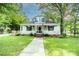 Inviting two-story home with a classic front porch and well-maintained lawn at 636 N Center St, Statesville, NC 28677