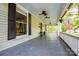 Relaxing covered front porch with ceiling fans, perfect for enjoying the outdoors at 636 N Center St, Statesville, NC 28677