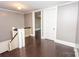 Upstairs hallway featuring hardwood floors, neutral paint, and access to other rooms at 636 N Center St, Statesville, NC 28677