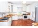 Bright kitchen with wooden countertops, white cabinets, and stainless steel appliances at 636 N Center St, Statesville, NC 28677