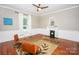 Comfortable living room featuring hardwood floors, fireplace, natural light and wood trim at 636 N Center St, Statesville, NC 28677
