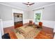 Inviting living room featuring a decorative rug, hardwood floors, and ample natural light at 636 N Center St, Statesville, NC 28677