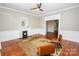 Comfortable living room featuring hardwood floors, fireplace, natural light and wood trim at 636 N Center St, Statesville, NC 28677