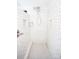 Shower featuring white subway tile, hexagon tile flooring, and built-in shelving at 636 N Center St, Statesville, NC 28677