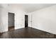 Bedroom with wood floors, white trim and an adjoining bathroom and closet at 6782 Kingfisher Ct, Denver, NC 28037