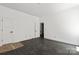 Spacious bedroom featuring white walls, hardwood floors, and a connecting door at 6782 Kingfisher Ct, Denver, NC 28037