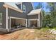 Open two-car garage with unfinished flooring and gray siding at 6782 Kingfisher Ct, Denver, NC 28037