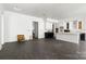 Expansive living area showcasing an open layout and white kitchen with a large island at 6782 Kingfisher Ct, Denver, NC 28037