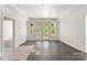 Spacious living room with French doors leading to the exterior and wood floors at 6782 Kingfisher Ct, Denver, NC 28037