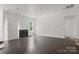 Bright living room with modern fireplace and hardwood floors at 6782 Kingfisher Ct, Denver, NC 28037