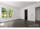 Well-lit room with a window showing trees at 6782 Kingfisher Ct, Denver, NC 28037