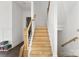 Staircase with wooden steps and black railing at 6782 Kingfisher Ct, Denver, NC 28037