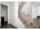 Staircase with wood and metal railings leading to the upstairs at 6782 Kingfisher Ct, Denver, NC 28037