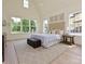 Serene main bedroom with plenty of natural light, a tufted headboard, and neutral tones at 7209 Alexander Rd # 3, Charlotte, NC 28270