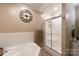 This bathroom includes a shower, a corner bathtub with tile surround, and decor at 785 Sanside Dr, York, SC 29745