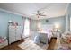 Charming bedroom with light blue walls and rainbow rug, perfect for a room at 785 Sanside Dr, York, SC 29745