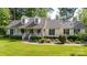 Charming home featuring a welcoming front porch, dormer windows, lush landscaping, and a well-maintained lawn at 785 Sanside Dr, York, SC 29745
