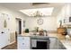 Bright kitchen adjacent to a dining area and featuring granite countertops at 785 Sanside Dr, York, SC 29745