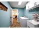 Well-lit laundry room featuring modern washer and dryer and adjacent kitchen view at 785 Sanside Dr, York, SC 29745
