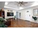 Open living area featuring hardwood floors, tray ceiling, and an open entry door for easy access at 785 Sanside Dr, York, SC 29745