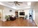 Cozy living room with a ceiling fan, hardwood floors, and an open doorway leading to the home's bedrooms at 785 Sanside Dr, York, SC 29745