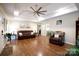 Spacious living room with hardwood flooring, ample seating, tray ceilings and an open doorway to the home at 785 Sanside Dr, York, SC 29745