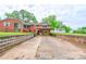 The backyard features a covered parking area, and detached garage behind the brick home at 800 Charles Rd, Shelby, NC 28150