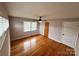 Bright bedroom with hardwood floors, two windows, and built-in shelving at 800 Charles Rd, Shelby, NC 28150