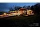 Charming single-story home with a brick exterior and a welcoming ramp decorated with string lights at 800 Charles Rd, Shelby, NC 28150