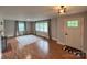 Inviting living room featuring light walls, beautiful floors, and many sun-filled windows at 800 Charles Rd, Shelby, NC 28150