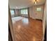 Bright living room with hardwood floors, large windows, and a welcoming front entrance at 800 Charles Rd, Shelby, NC 28150