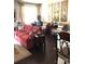 Cozy living room features a red sofa, decorative wall art, and ample natural light at 8039 Scarlet Oak Ter, Fort Mill, SC 29707