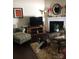 Cozy living room features a fireplace and hardwood floors at 8039 Scarlet Oak Ter, Fort Mill, SC 29707