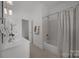Bathroom featuring modern fixtures, vanity with ample counter space and tub at 8441 Sandowne Ln, Huntersville, NC 28078